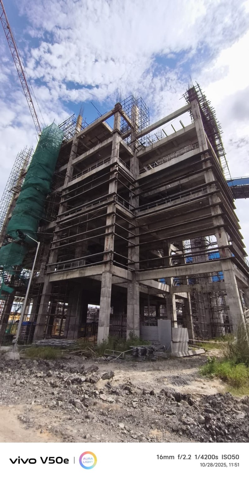 Multi-storey industrial structure on an active construction site